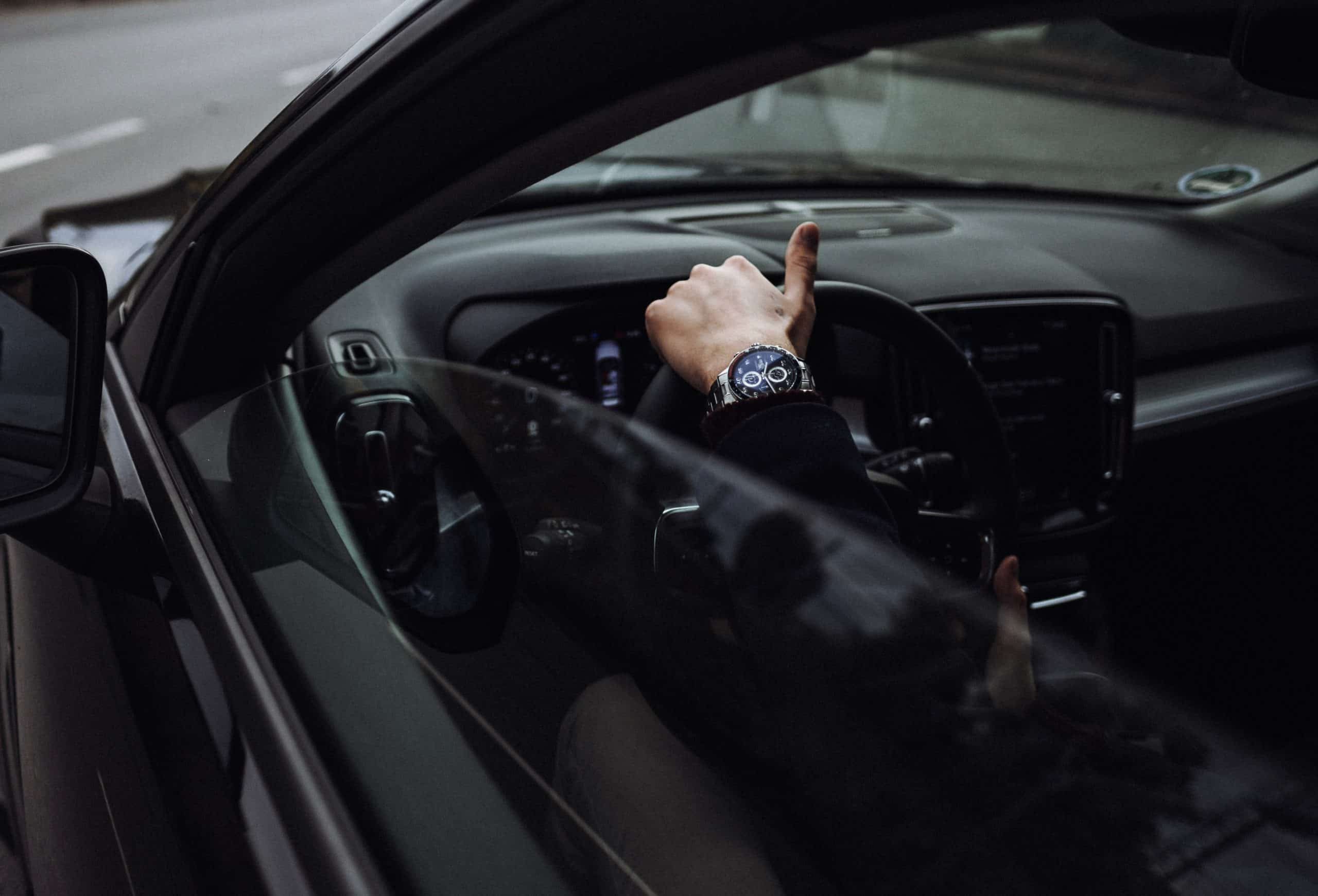 man driving car