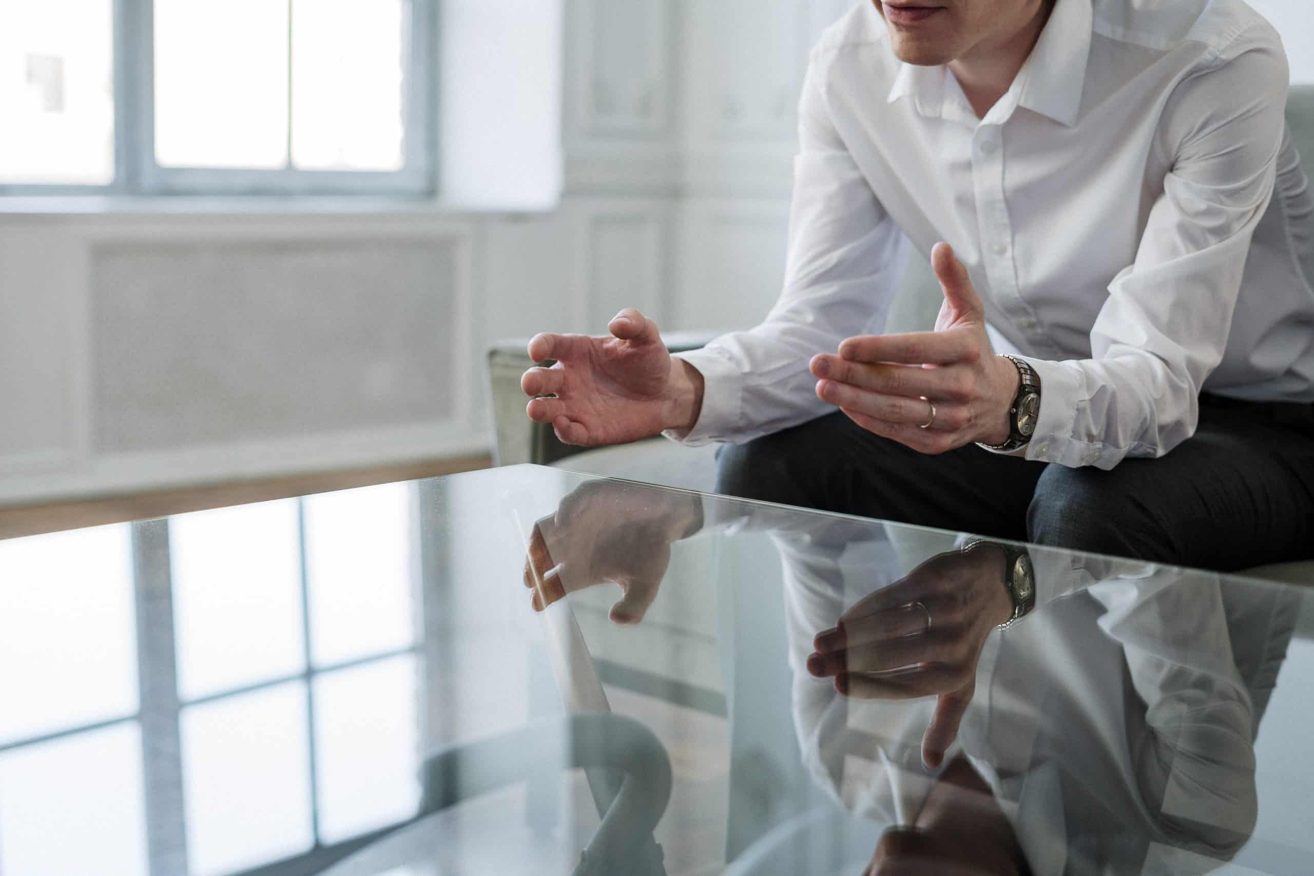 man explaining at meeting