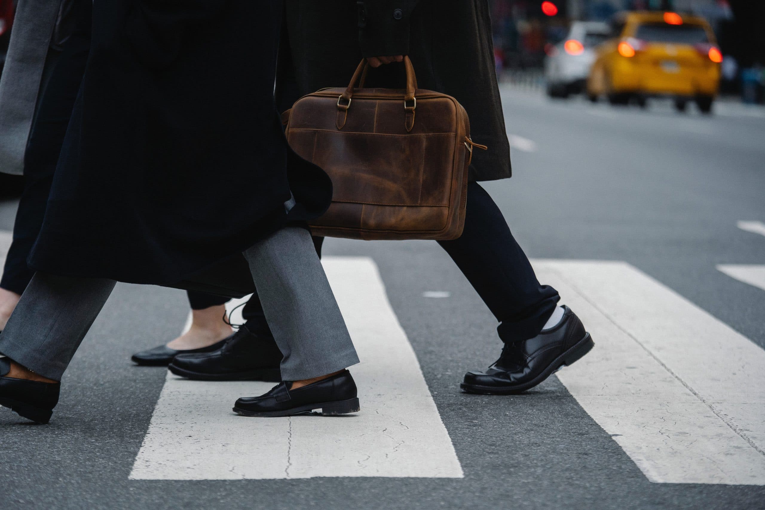 pedestrians in smart clothing crossing a pedestrian crossing